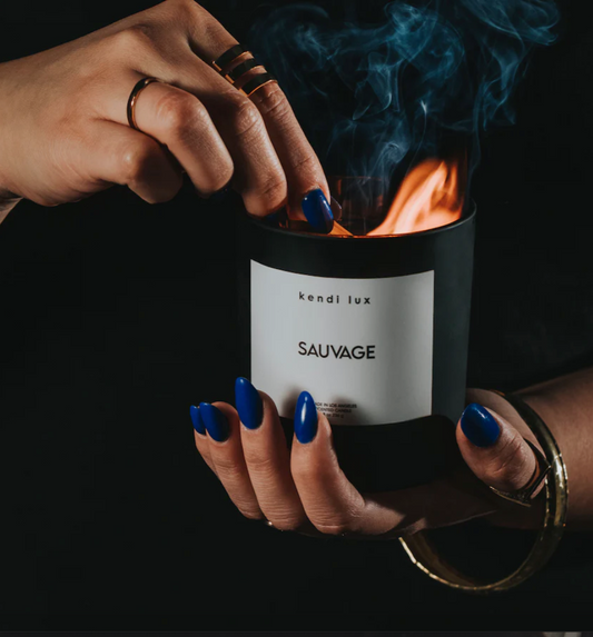 Soy blend candle with braided cotton wick in a black glass tumbler. - Sauvage